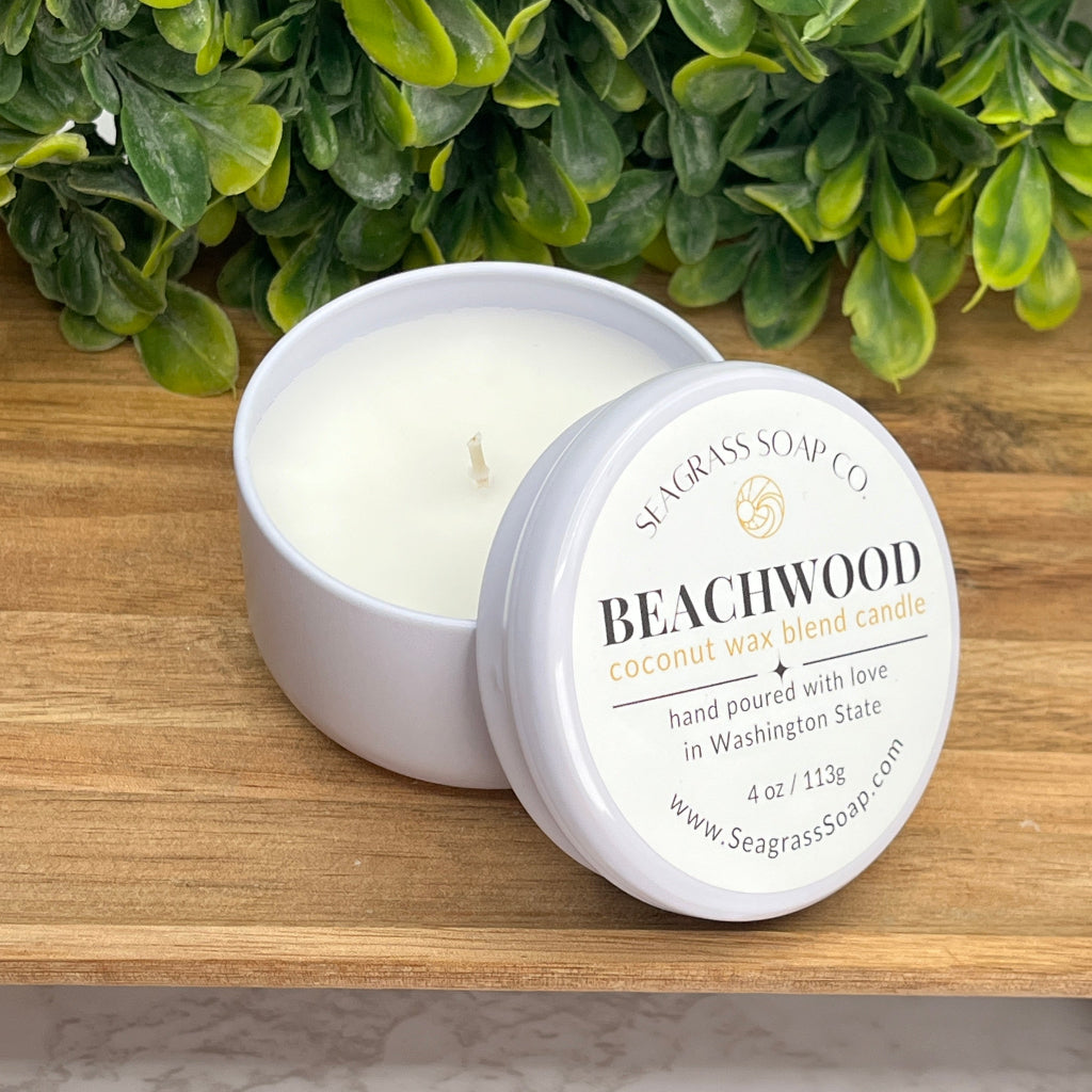 A 4oz re-usable travel tin candle scented in Beachwood and Vetiver.