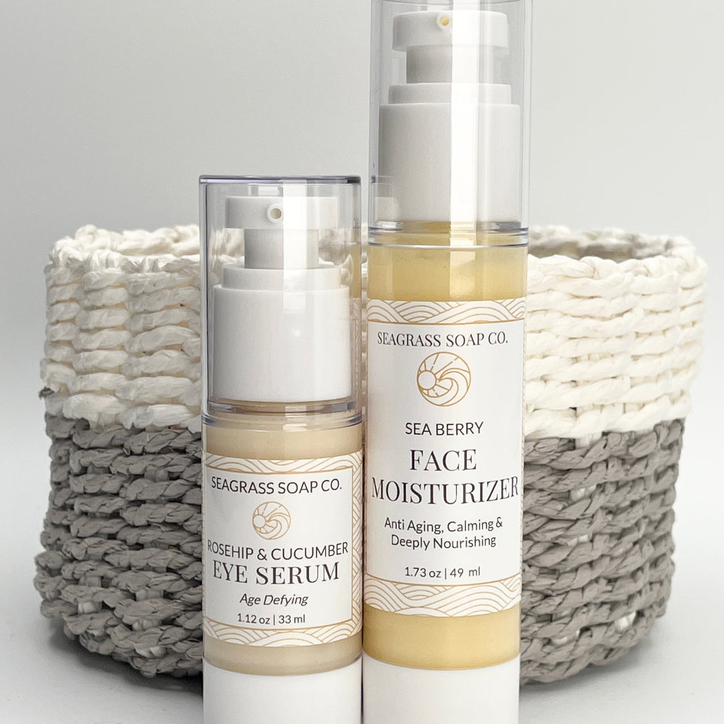 Two skincare products from Seagrass Soap Co. in front of a woven basket on a white background