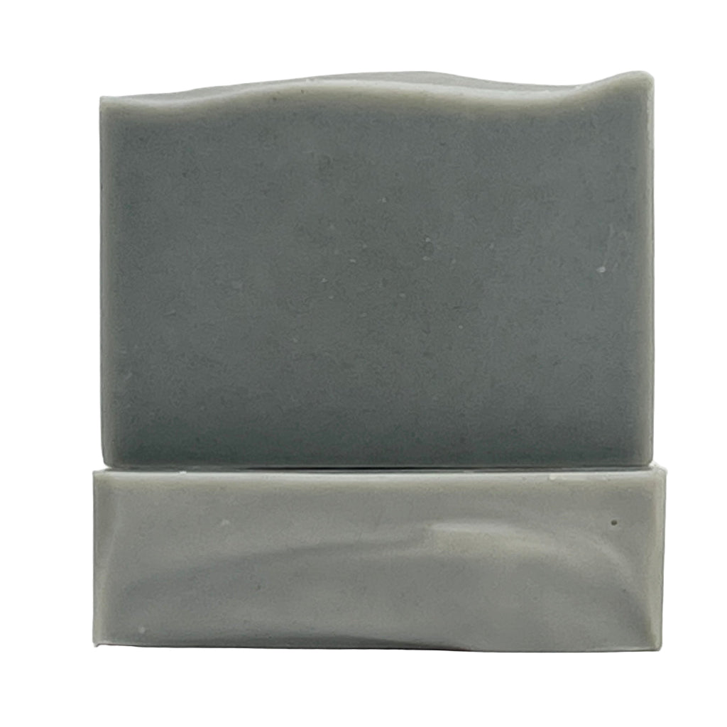 Coastal Mist natural, ocean water soap bar with Eucalyptus and Mint essential oils in a grey color on a white background.