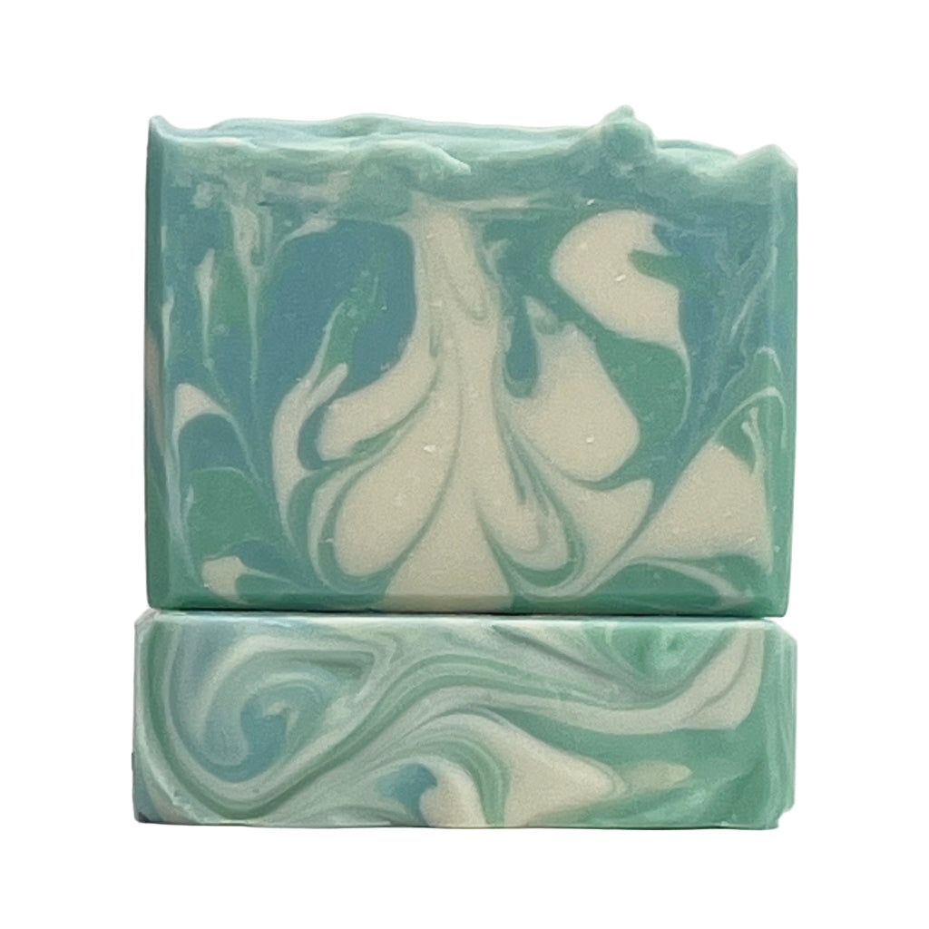 Cool Waters ocean water soap bar with green, blue and white swirls on a white background by Seagrass Soap Co.