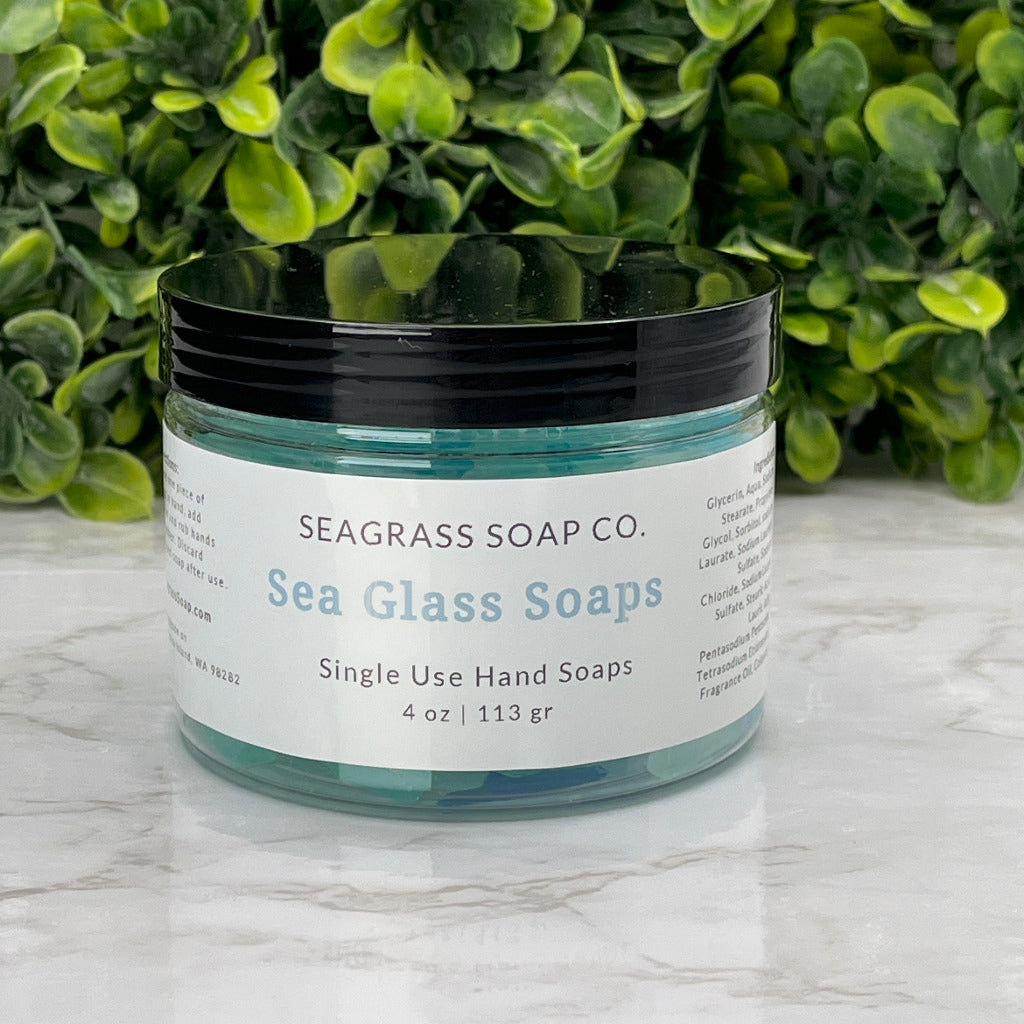 A jar of single use faux sea glass hand soaps.