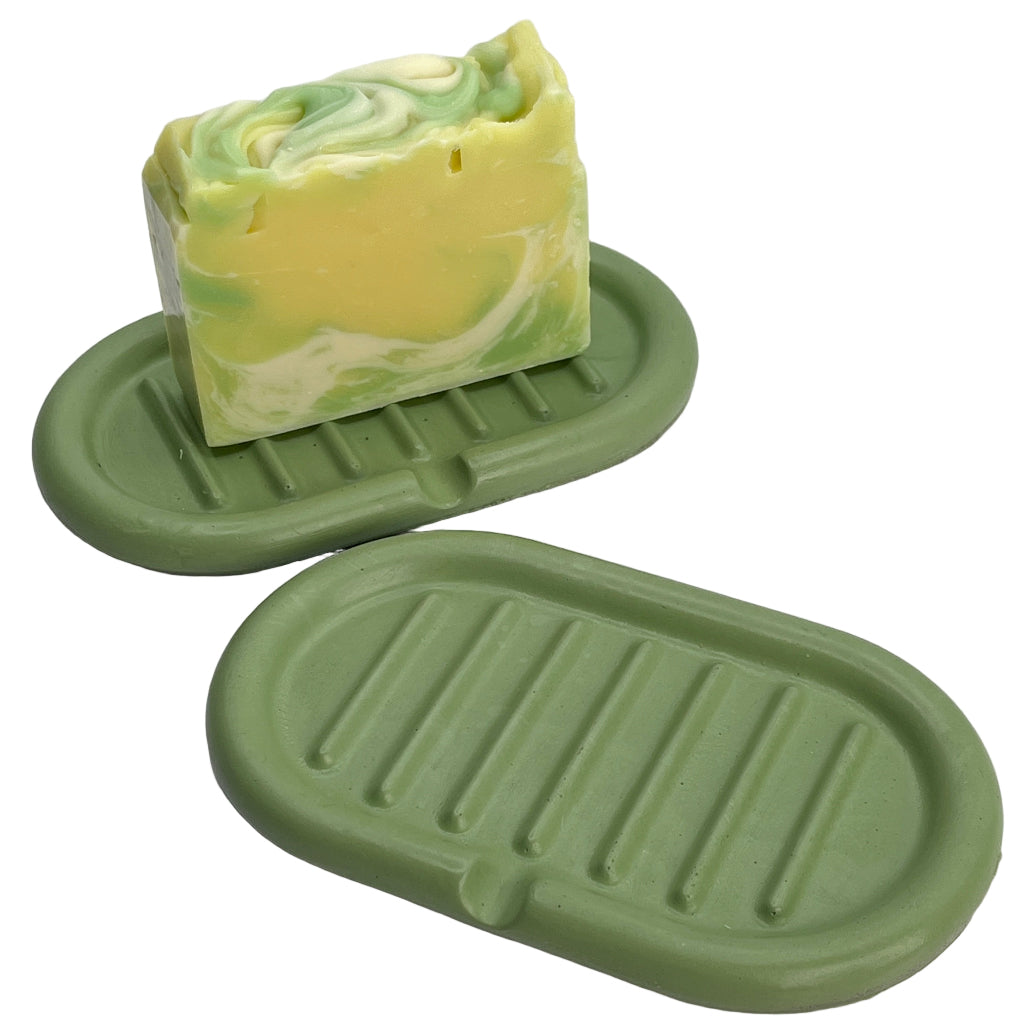 Hand poured self draining concrete soap dish in green for kitchens or bathrooms.