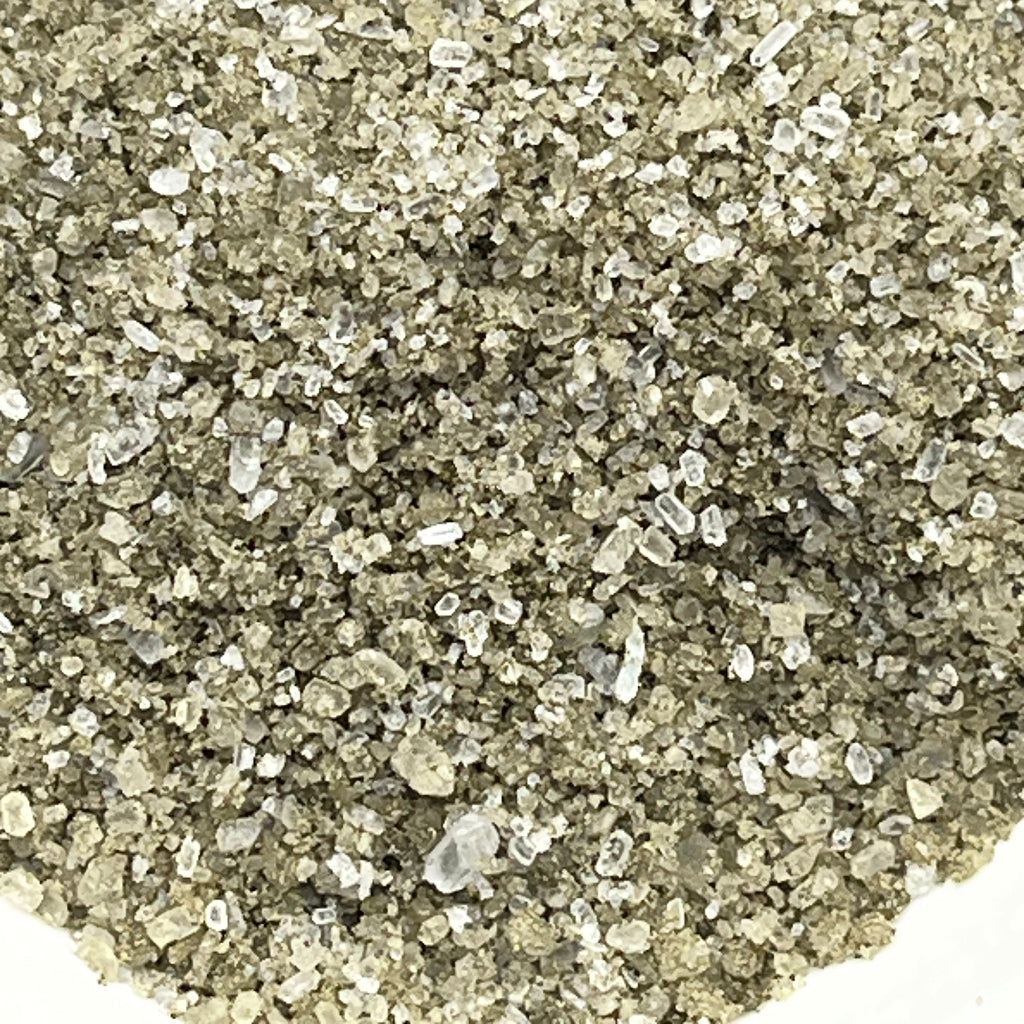 Close-up of ocean therapy bath salts on a white background