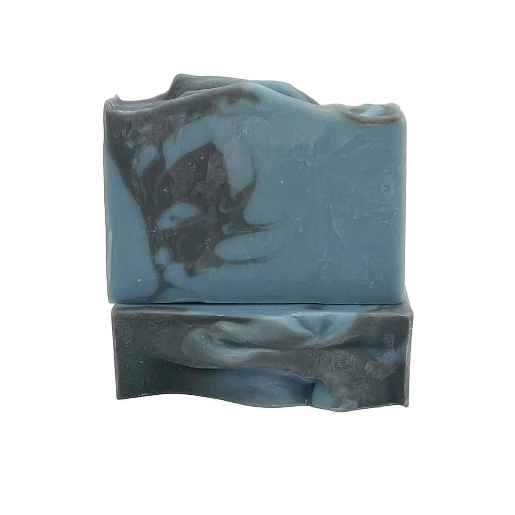 Two bars of Salty Mariner dark blue soap on a white background