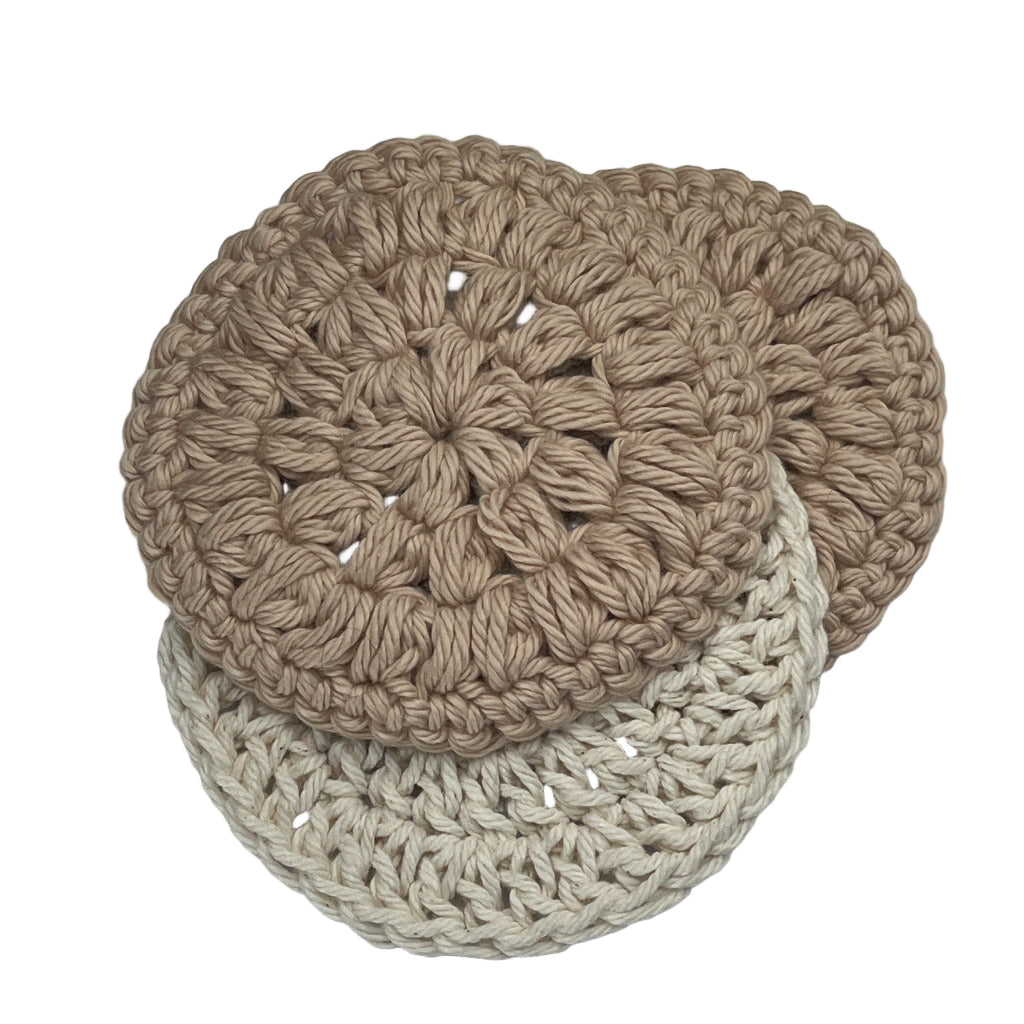 Set of three face cleansing round scrubbies. Two are a solid tan color and one is a cream color.
