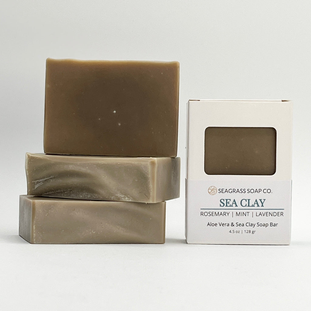 Three Sea Clay ocean water soap bars and box package on a white background.