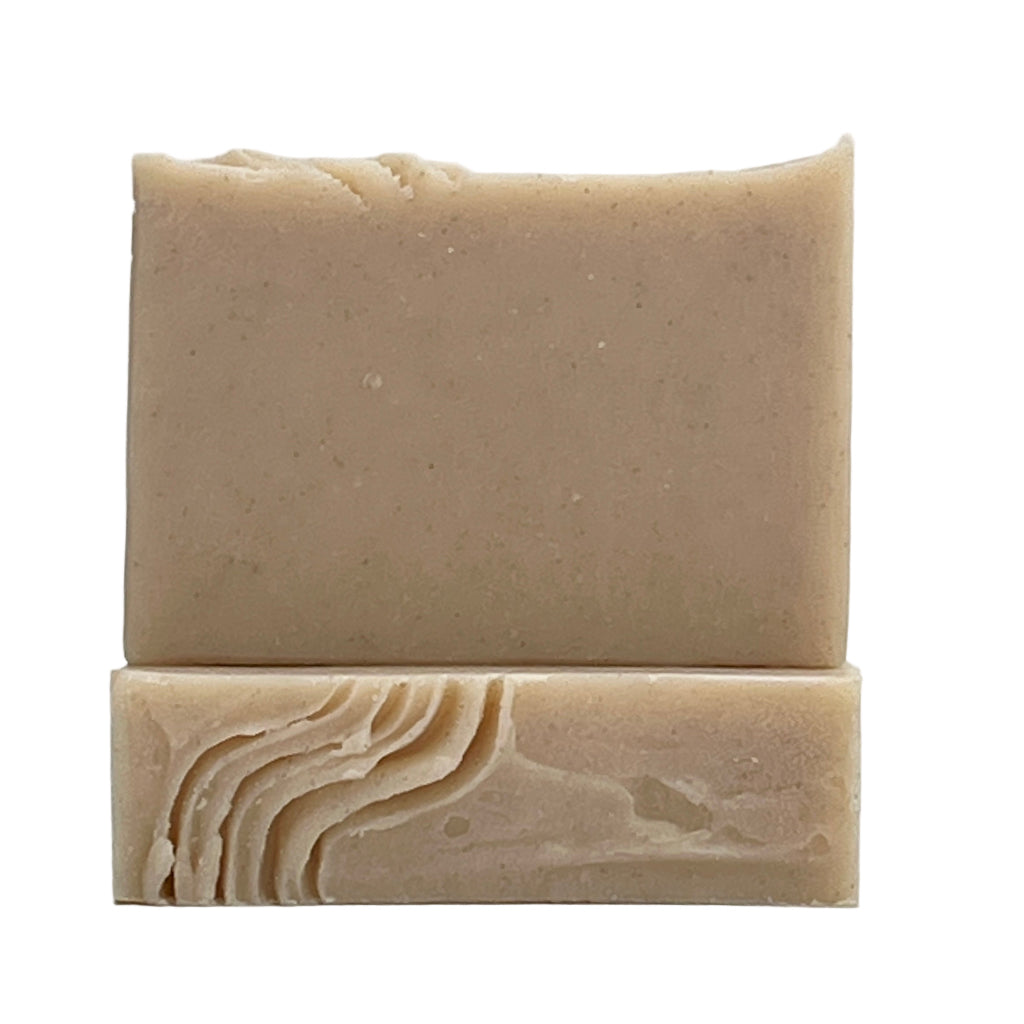 Sea Renewal soap bar scented with jasmine, sea breeze and mandarin. Enriched with pumice and volcanic sands for a gentle exfoliation in a natural color on a white background by Seagrass Soap Co.