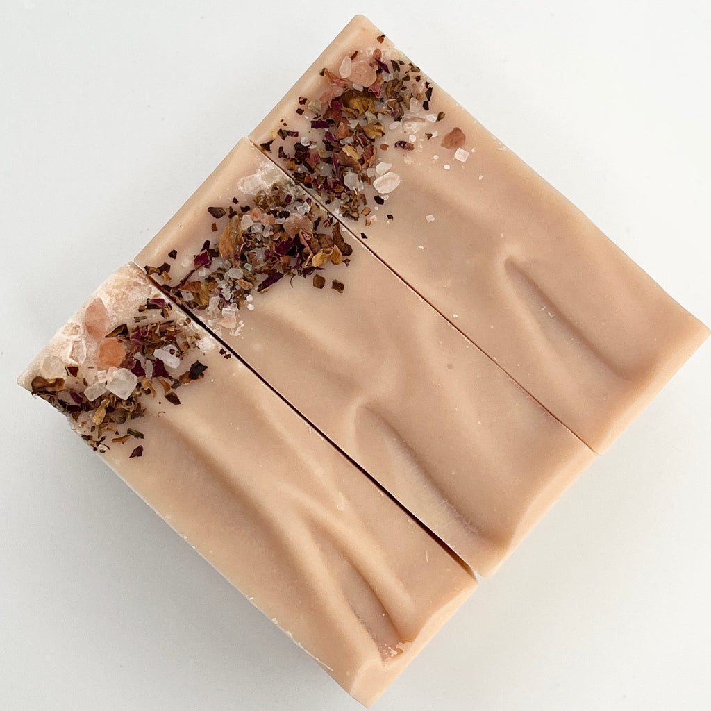 Bar of soap with decorative elements on a white background