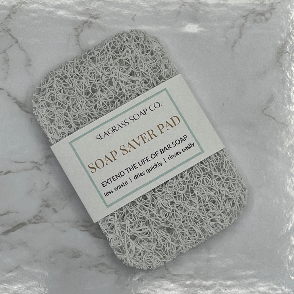 A single soap bar saver pad in white.