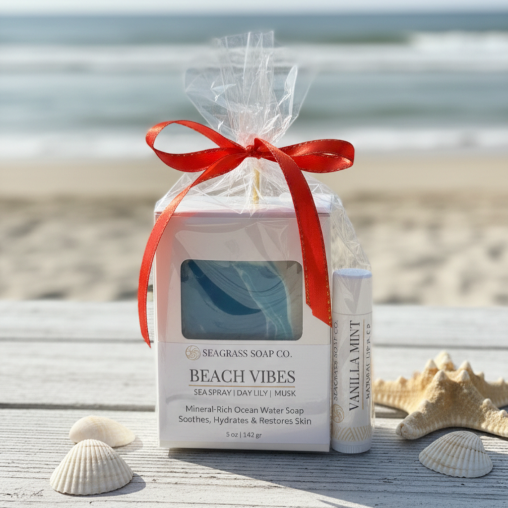 Gift set with soap bar and 'Vanilla Mint' lip balm on a beach setting