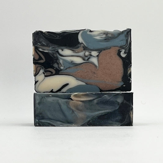 Beachwood ocean water marbled soap bar with black, gray, and brown colors on a white background by Seagrass Soap Co