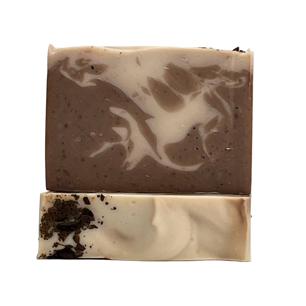 Coastal Brew ocean water soap bar with exfoliating organic coffee beans showing brown and cream swirls on a white background by Seagrass Soap Co.