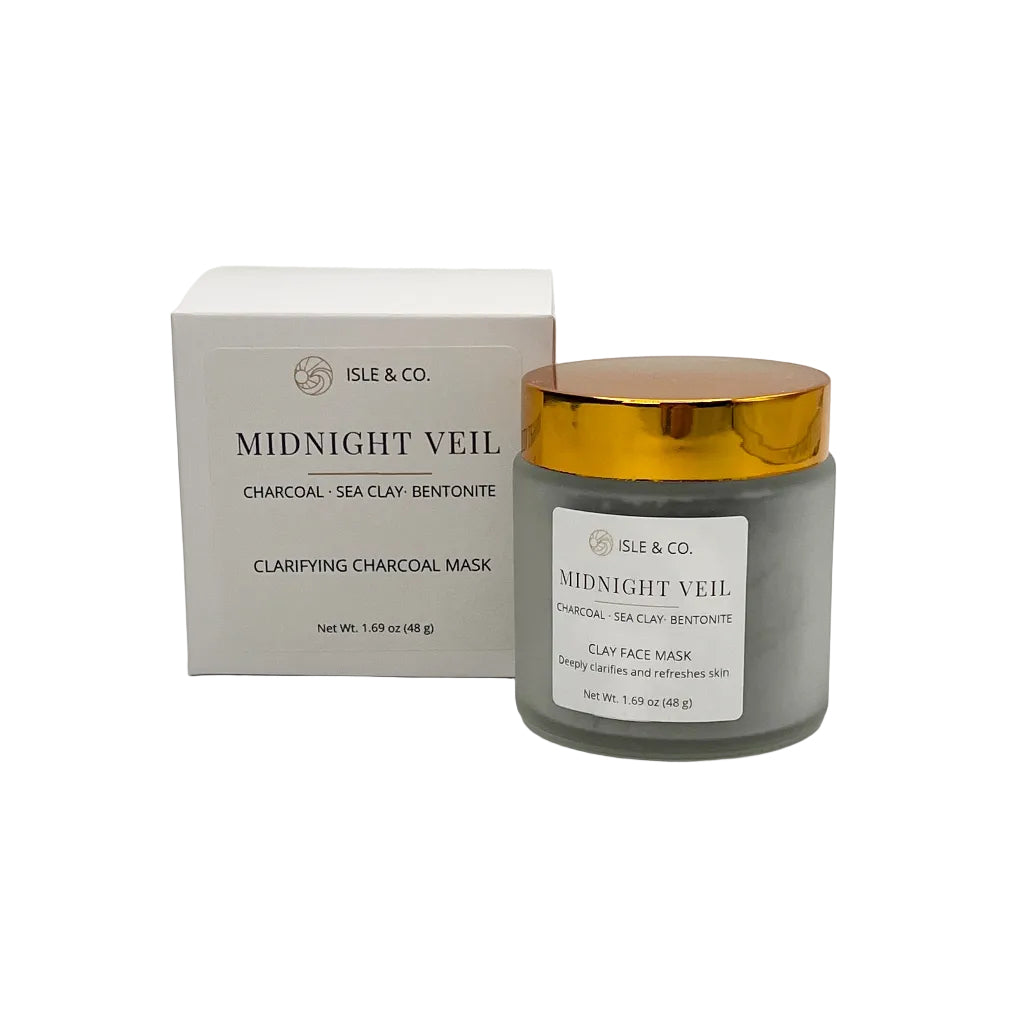 Clarifying charcoal mask jar with gold lid and Isle & Co packaging on a white background