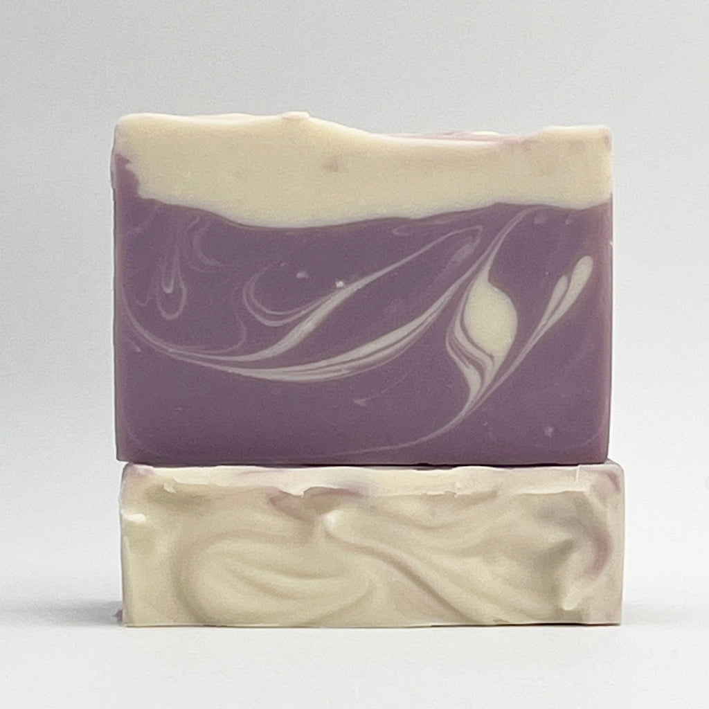 Seagrass Soap Co's Lavender ocean water soap bar with purple and white swirls on a white background.
