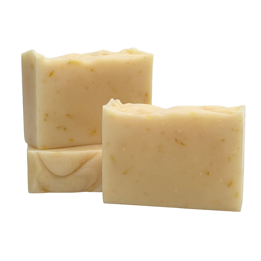 Three bars of lemongrass lavender soap on a white background