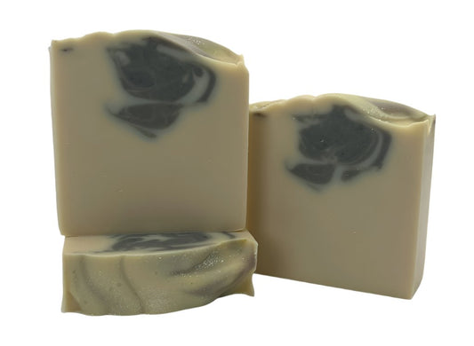 Three bars of soap reflecting a pristine landscape of freshly fallen snow. With a creamy white base and a swirl of indigo and topped with biodegradable glitter.