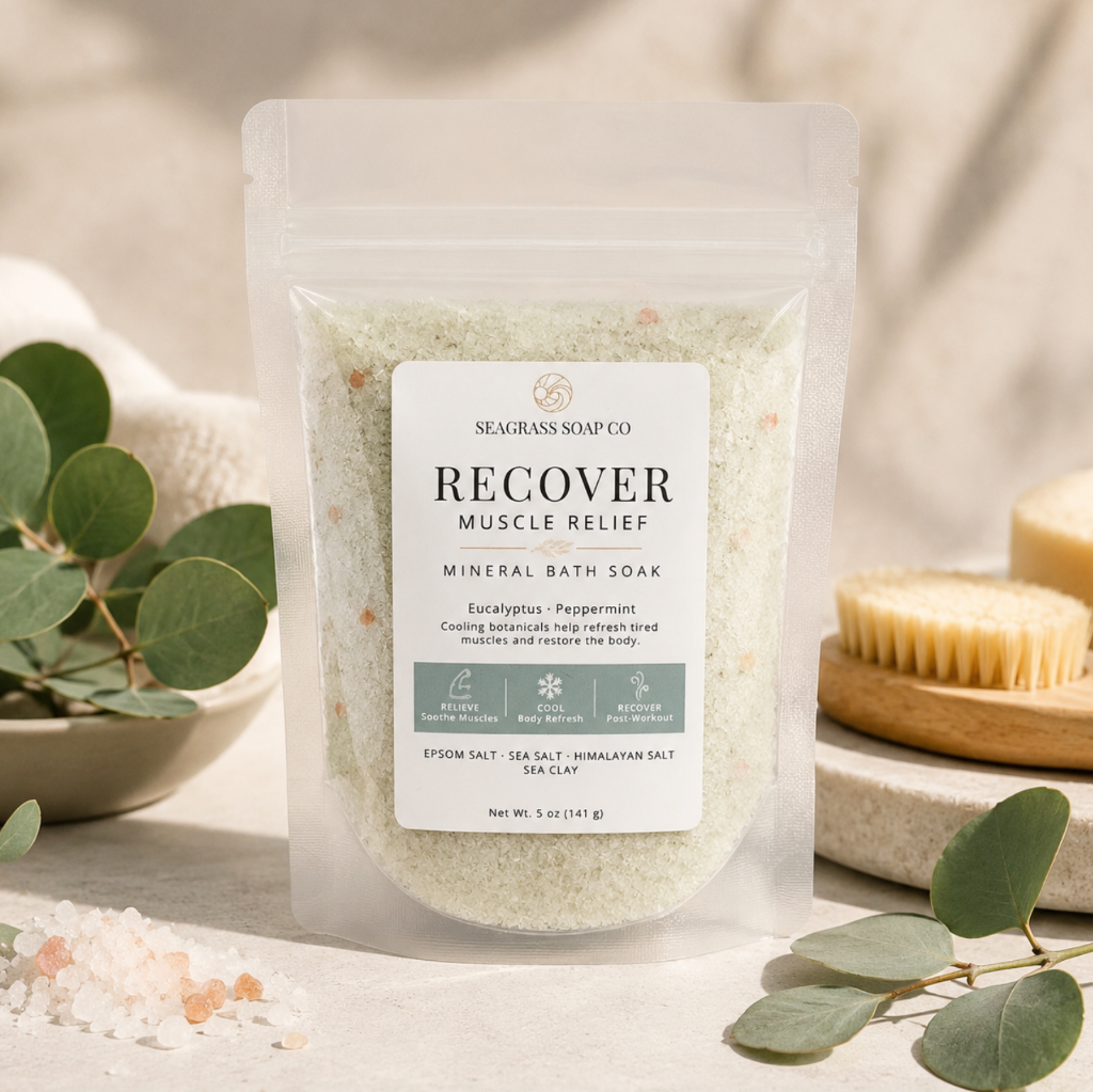Recover mineral bath soak displayed with eucalyptus leaves, mineral salts and a spa-inspired setting.