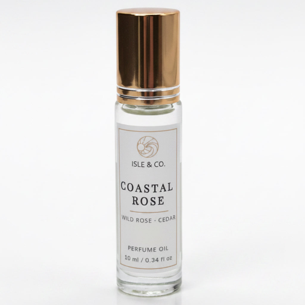 Roll on Perfume oil bottle labeled 'Coastal Rose' by Isle & Co. on a white background