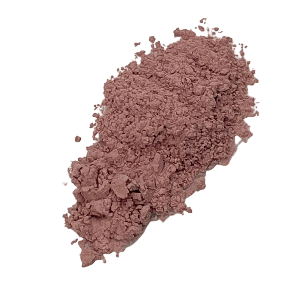 Rose clay face mask texture on a white background