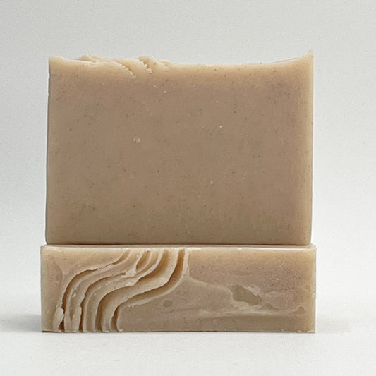 Sandy Shores soap bar scented with jasmine, sea breeze and mandarin. Enriched with pumice and volcanic sands for a gentle exfoliation in a natural color on a white background by Seagrass Soap Co.