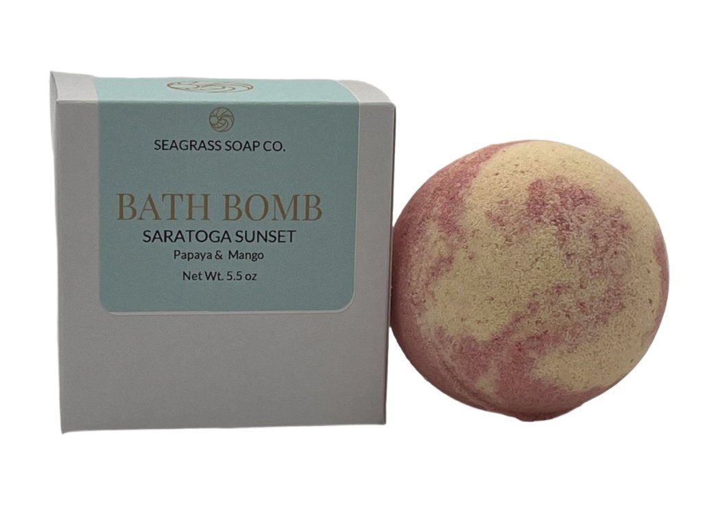 A papaya and mango bath bomb with box