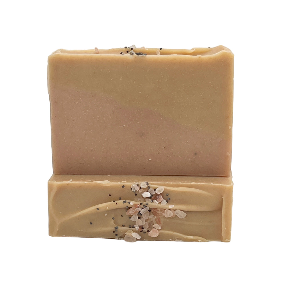 Two bars of Saratoga Sunset Papaya and Mango soap with decorative elements on a white background