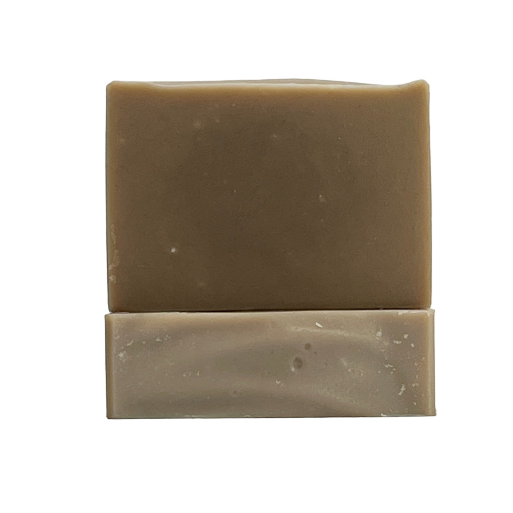 Two sea clay soap bars stacked on a white background