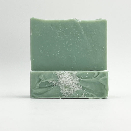Two green Sea Glass ocean water soap bars on a white background