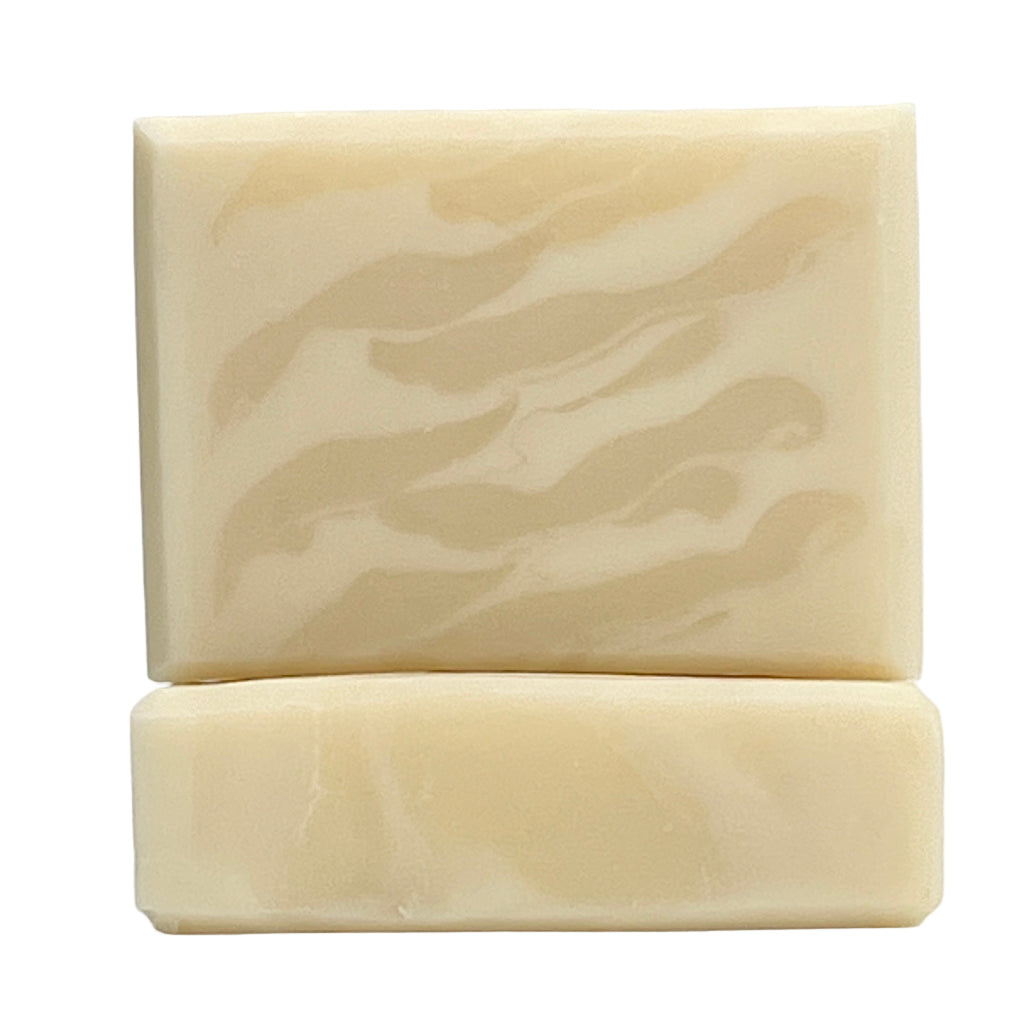 Unscented white soap bar by Seagrass Soap Co showing a wavy design  on a white background