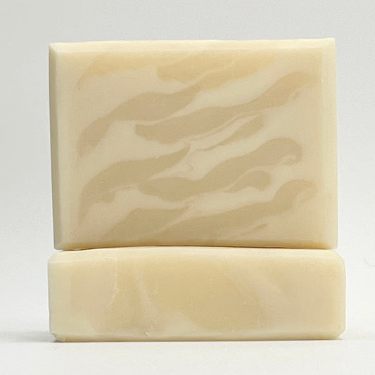 Unscented white soap bar by Seagrass Soap Co showing a wavy design  on a white background